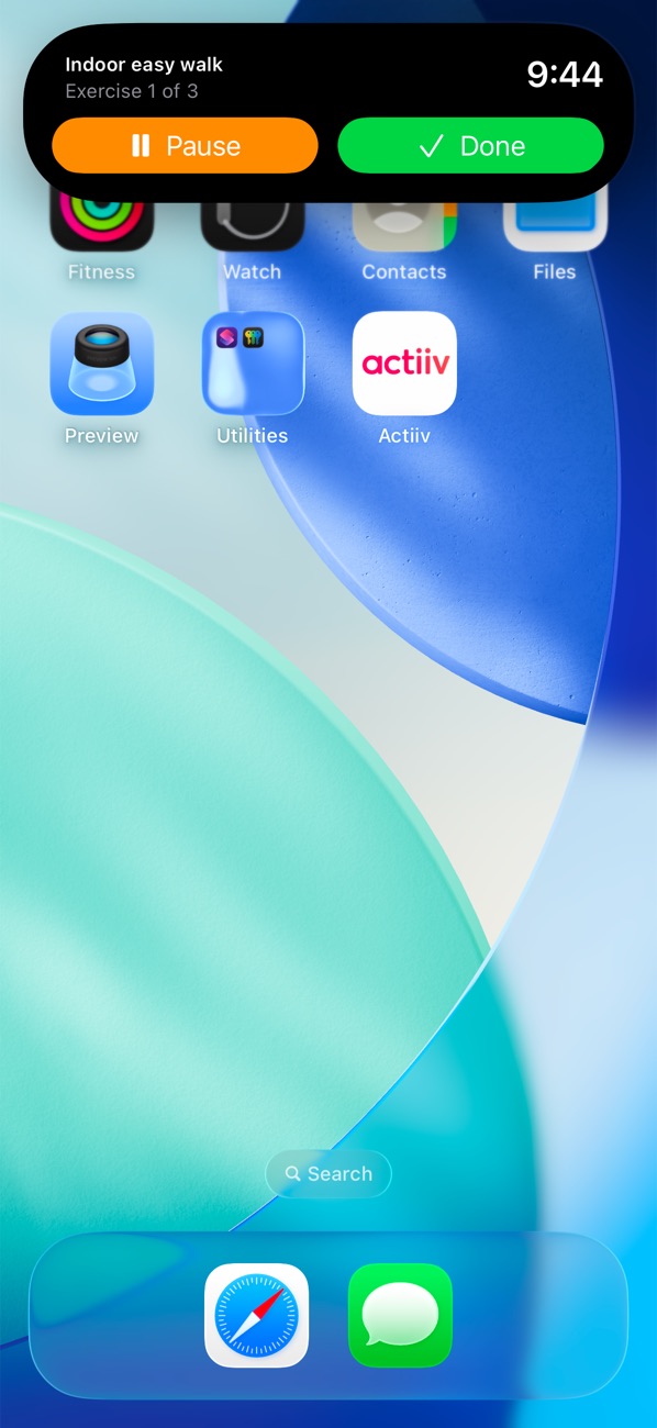 The Dynamic Island expanded on the iPhone Home Screen, showing Indoor easy walk, a 9:44 countdown, and Pause and Done buttons